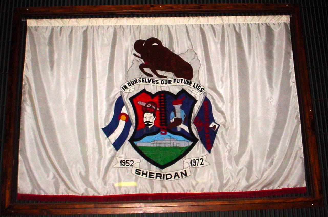 Picture of school crest banner inside the auditorium.